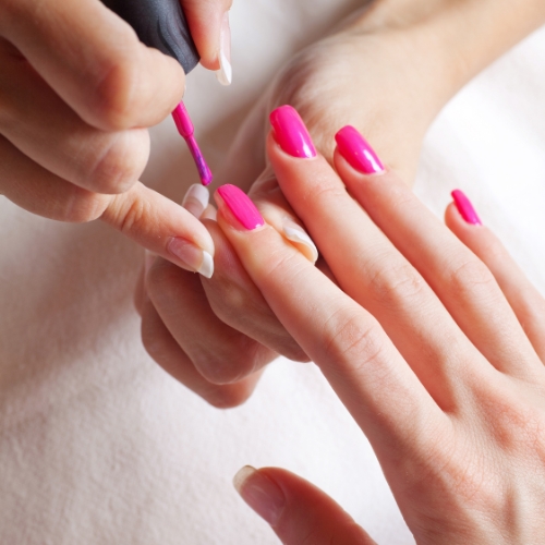 Manicure with bold pink gel polish at makeover palace
